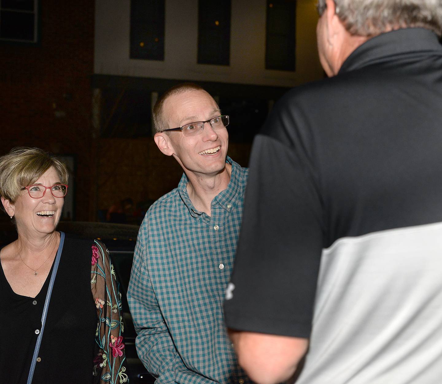 Dave Stewart is congratulated on his mayoral victory Tuesday night outside Canal Port on Mill Street in Utica.