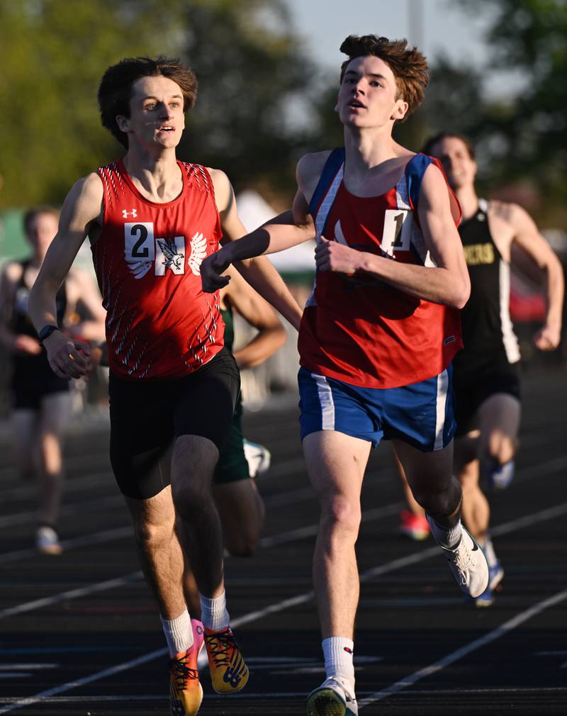 Glenbard South’s Lucas Galas, right, just edges Naperville Central’s Lukas Probst at the finish line in the 800-meter run during the DuPage County boys track and field meet at Wheaton Warrenville South High School on Friday, May 9, 2025 in Wheaton. Galas’ time was 1:58.14, while Probst’s time was 1:58.27