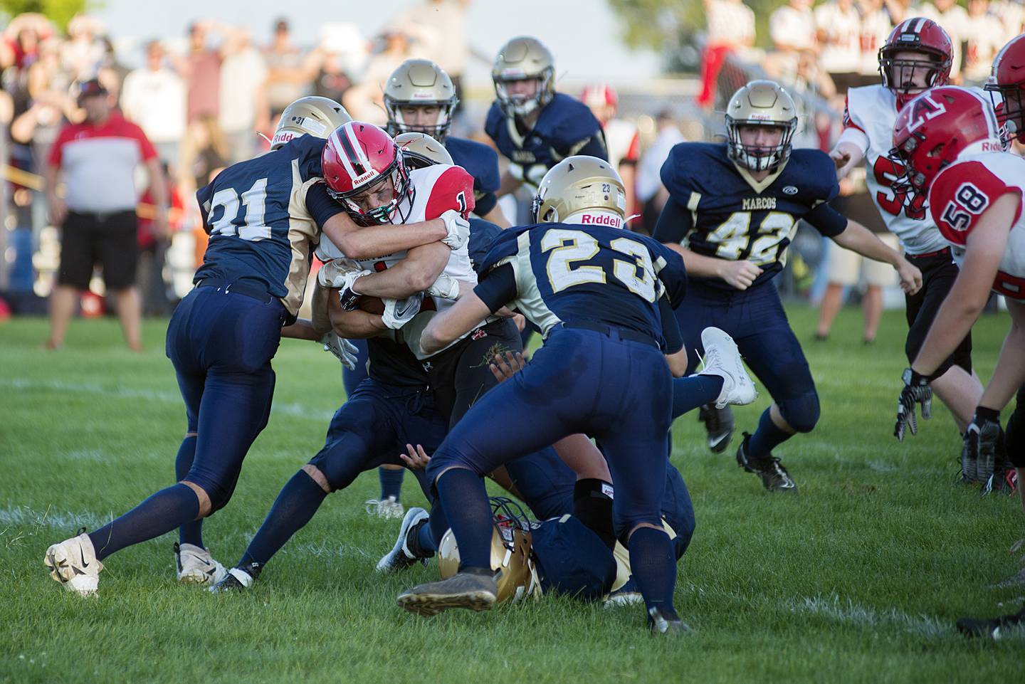 Amboy’s Kyle Koch fights for yards against Polo Friday, Aug. 26, 2022.