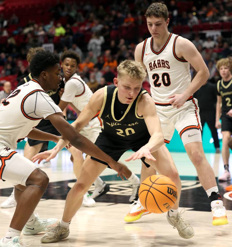 Sycamore's Isaiah Feuerbach goes after a loose ball between DeKalb's Derrion  Straughter (left) and DeKalb's Lukas Stubblefield Friday, Jan. 30, 2026, during the FNBO Challenge at the Convocation Center at Northern Illinois University in DeKalb.