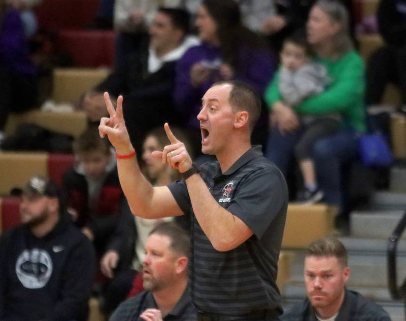 Huntley’s Head Coach Collin Kalamatas guides the Red Raiders against Hampshire in varsity boys basketball on Friday, Dec. 19, 2025, at Huntley High School in Huntley.