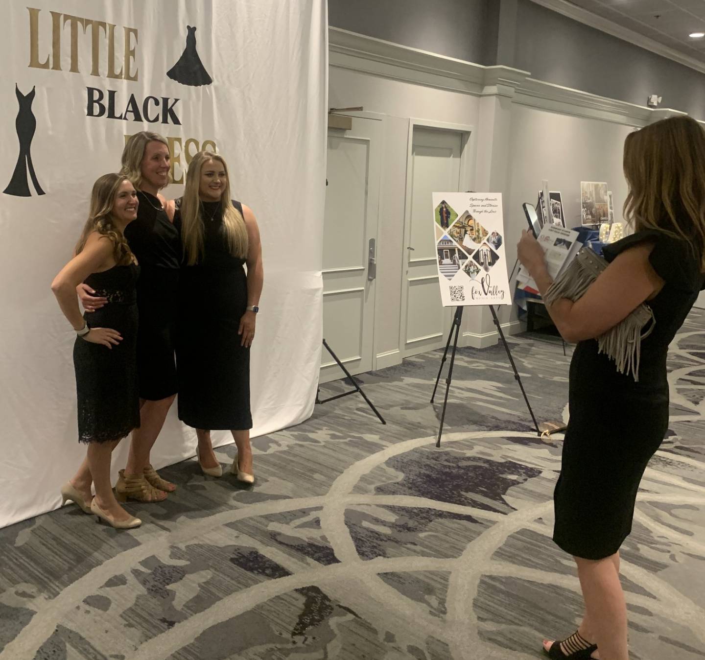 Women pose for photos at CASA of McHenry County’s Little Black Dress celebration and fundraiser in Crystal Lake Oct. 10, 2024.
