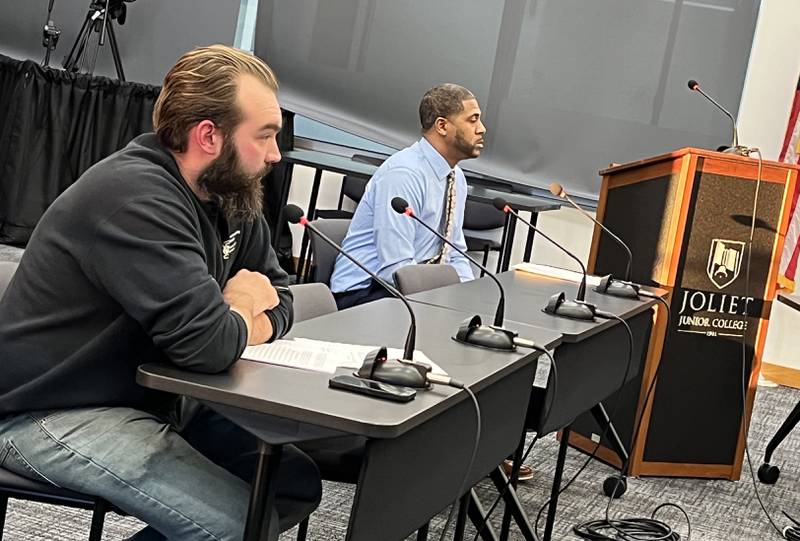 Eric Moon (left) and Darryl Link sit at an electoral board hearing on Thursday, Dec. 5, 2024, at Joliet Junior College in Joliet.