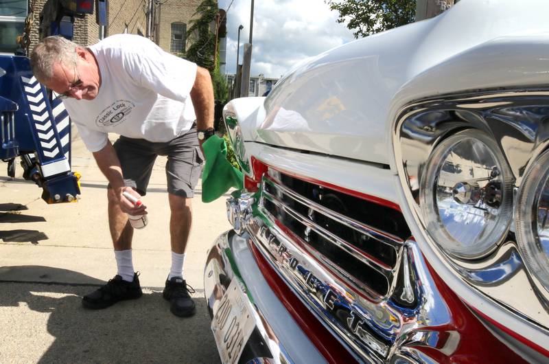 Mark Anning, from Tonica, shines the lights and grill of his 1959 Chevy Apache truck Sunday, July 31, 2022, during the 22nd Annual Fizz Ehrler Memorial Car Show in Sycamore.