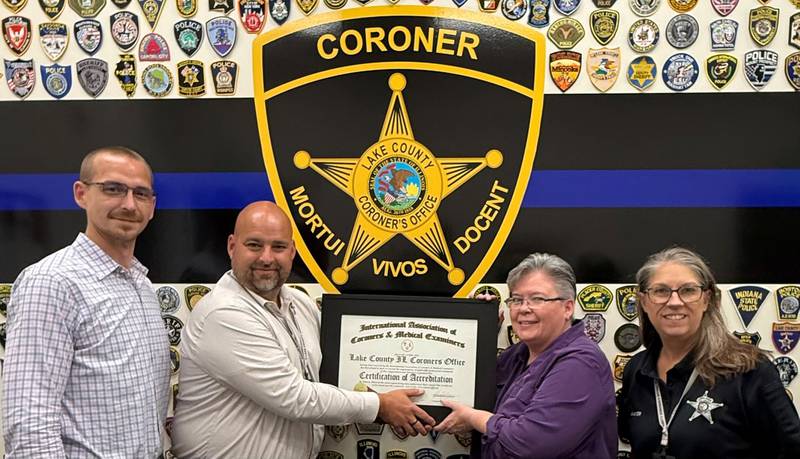 IAMCE President Shane Sheets (from left), Lake County Chief Deputy Coroner Steve Newton, IACME Chair of Accreditation Committee Tami Sedivy-Schroder, Lake County Senior Deputy Coroner Tammy Mayer