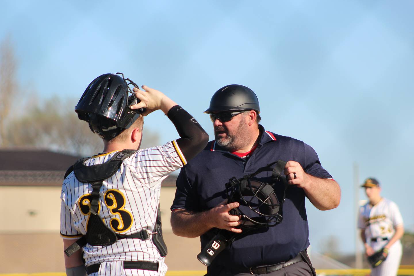 Rodger Griffith (right) has umpired at Little League, high school and summer ball levels over his 40 years in the northern Illinois area.