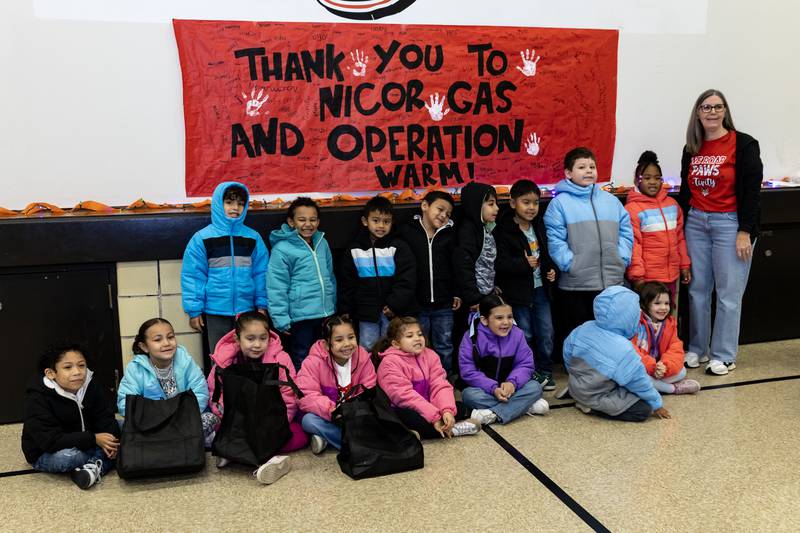 Kindergarteners take a group photo wearing their new coats from Nicor Gas, in collaboration with Operation Warm, at T. E. Culbertson Elementary School on Nov. 7, 2025.