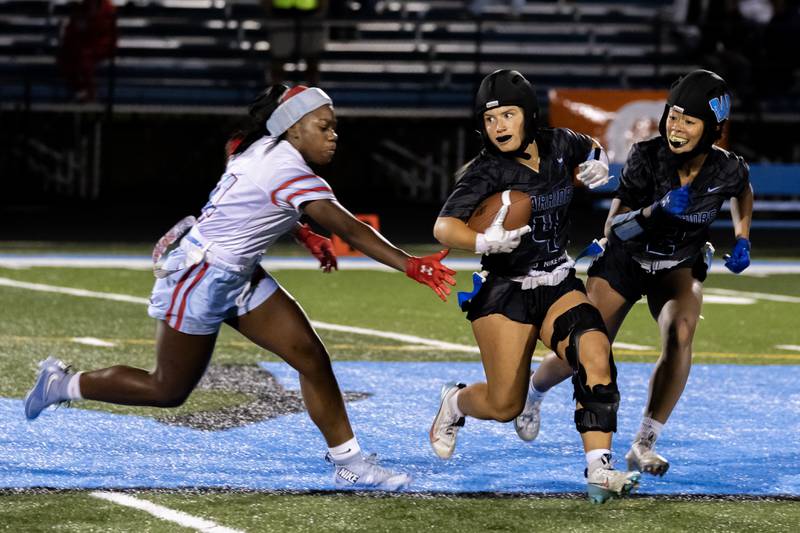 Willowbrooks's Lilli Macias makes a nice move during a varsity flag football IHSA State Quarterfinals game against Kenwood, held at Willowbrook High School on Oct. 17, 2025.