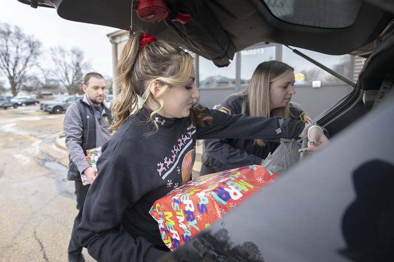 Valerie Villaneda and Autumn Day prepare a load of gifts Monday, Dec. 23, 2024, for Rock Falls police’s Operation Santa.