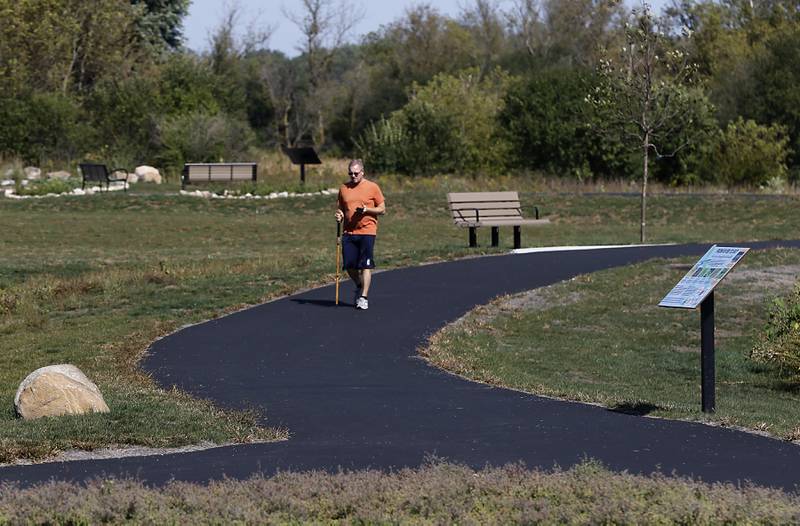 Mike Hartman walks along the accessible loop trail  on Saturday, Sept. 27, 2025, at the Crystal Lake Parks District’s new Lakewood Meadows Park.