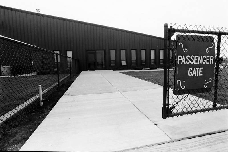 A view of the passenger gate sign outside the Illinois Valley Regional Airport in 1986.