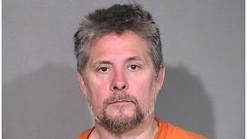 Man allegedly threatened to shoot at people at Island Lake bar, hit patron with shotgun
