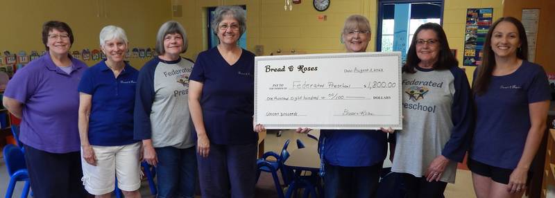 (Left to right); Bread and Roses steering committee members Sharon McKee, Lynn Fisher McCanne, Federated Preschool support team secretary Sharon Hollister, Bread and Roses artistic director Peggy Safford, Federated Preschool director Bobbi Clough, Federated Preschool support team president Pam Jackson, and steering committee member Jenny Covert