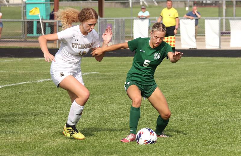 Sycamore's Kate Elsner and Boylan's Gracie Rose fight for possession during their Class 2A sectional semifinal game Tuesday, May 21, 2024, at Belvidere High School.