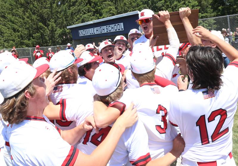 Members of the Hall baseball team celebrate after defeating Sherrard during the Class 2A Sectional final game on Saturday, May 27, 2023 at Knoxville High School.