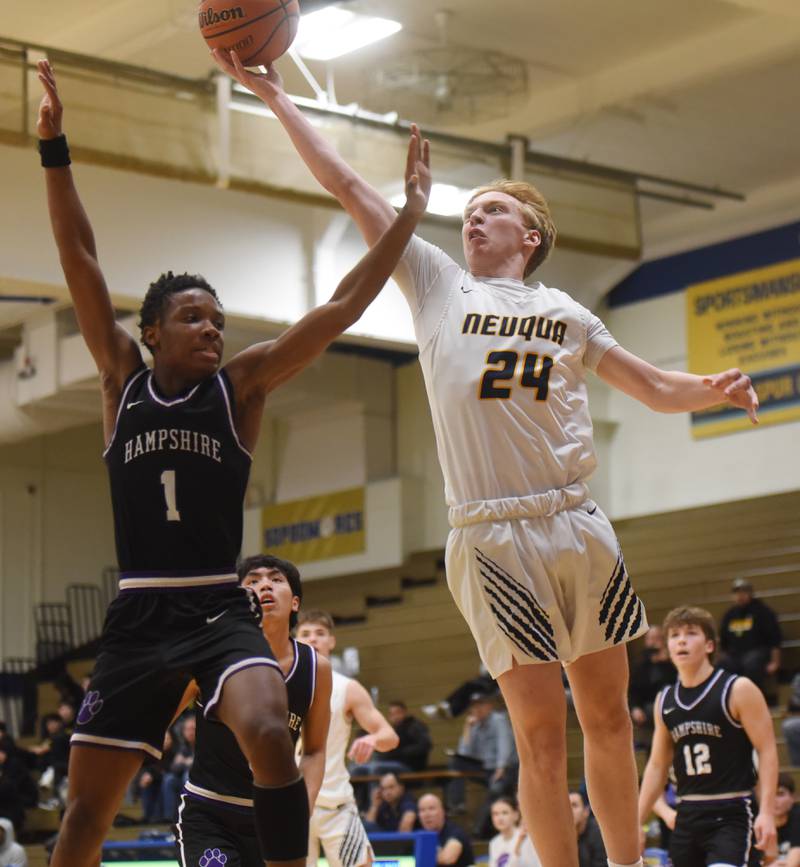 Neuqua Valley's Colin Gerrity, right, goes to the basket against Hampshire’s Chayse Gray during semifinals of the Wheeling Hardwood Classic basketball tournament Friday December 29, 2023 in Wheeling.