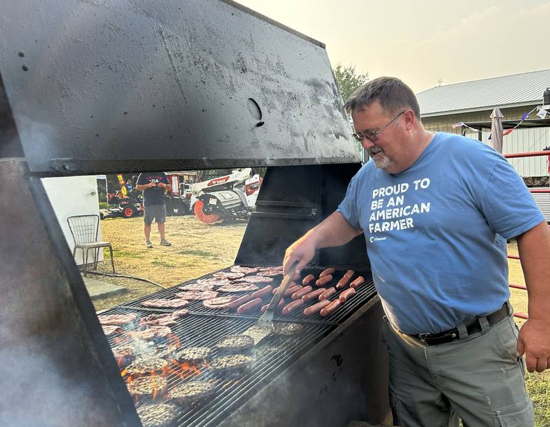 Bill Ohlwine was one of the Ogle County Beef Producers who was busy grilling for the group's food stand at the Ogle County Fair in Oregon on Thursday, July 31, 2025.