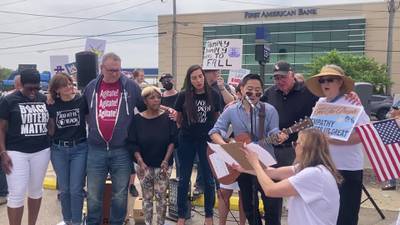 "No Kings" protest in Joliet performance of "This Land is Your Land"