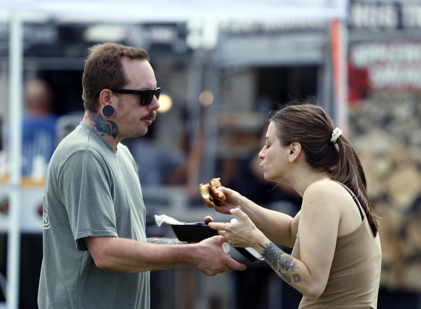 Nikko and Katie Faciano of Crystal Lake share a brisket sandwich during Lake in the Hills Rockin’ Rotary Ribfest Saturday, July 12, 2025 in Lake in the Hills.