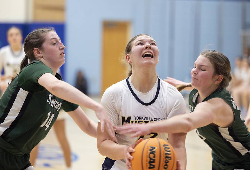 Yorkville Christian’s Ava Diqui is fouled against St. Edward’s Tuesday, Feb. 25, 2025, in the Class 1A Sectional at Hinckley-Big Rock.