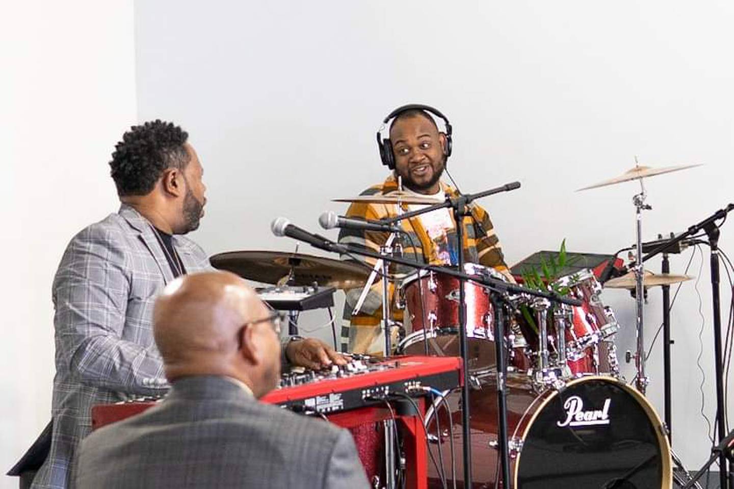 Members of The Way Church of Joliet celebrate its eighth anniversary in April 2022 at its new space on Theodore Street in Joliet.  Pictured are worship team leader Andre Thompson on keyboards and Kyler Winfrey on drums.
