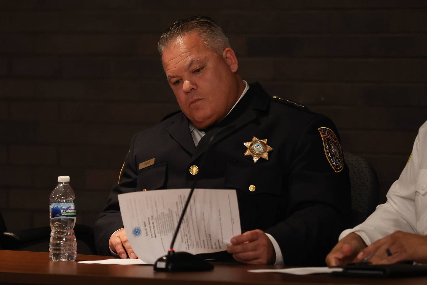 Joliet Police Chief William Evans looks over the meeting agenda at the Joliet City Council Meeting. Tuesday, Mar. 1, 2022, in Joliet.