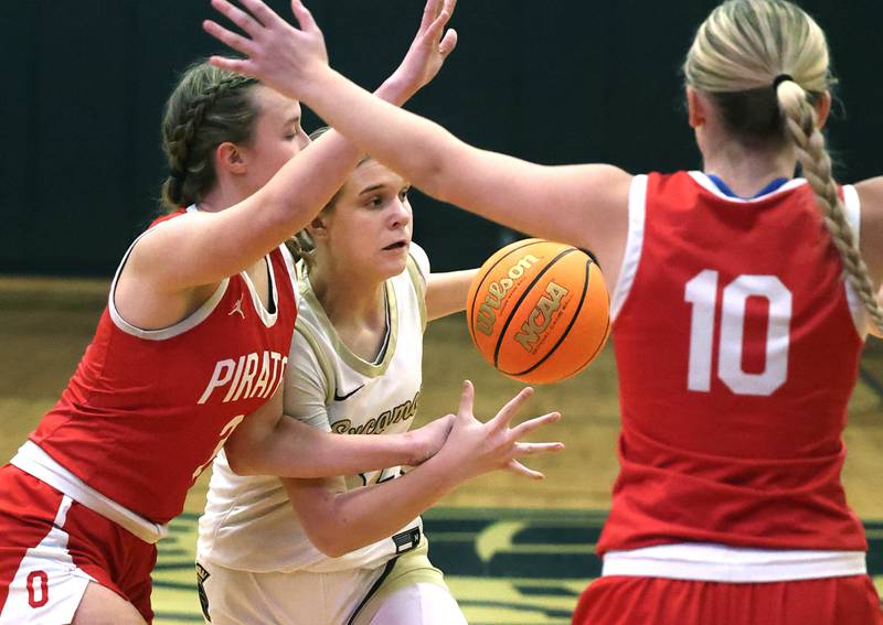 Sycamore's Quinn Carrier tries to get between Ottawa's Skylar Dorsey (left) and Ella Schmitz during their game Friday, Jan. 10, 2025, at Sycamore High School.