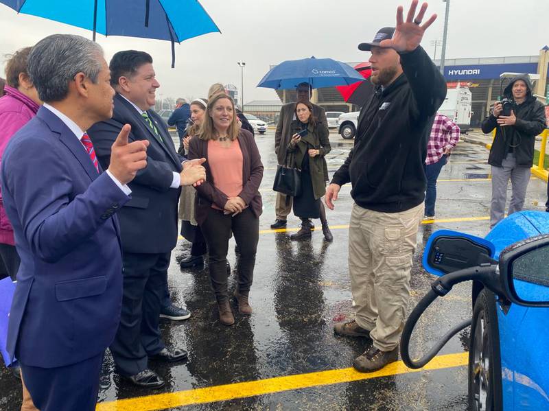 ComEd Ceo Gil Quiniones, Gov. JB Pritzker, State Sen. Rachel Ventura, and Ed West, owner of Joliet’s Veterans Energy Team, which facilitated the installation of the charging station.