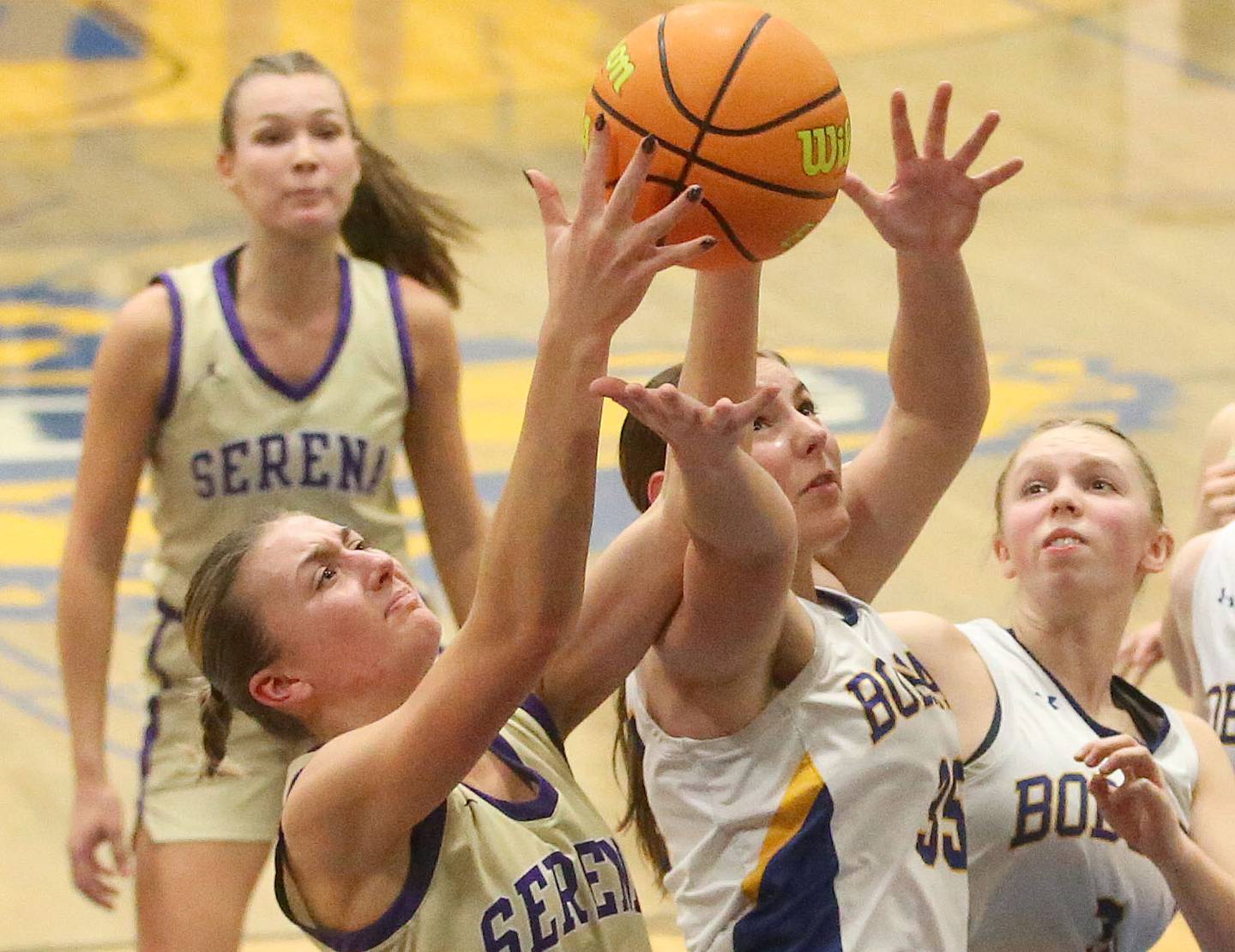 Serena's Kendall Whiteaker grabs a rebound over Somonauk/Leland's Kennedy Barshinger on Monday, Feb. 10, 2025 at Somonauk High School.