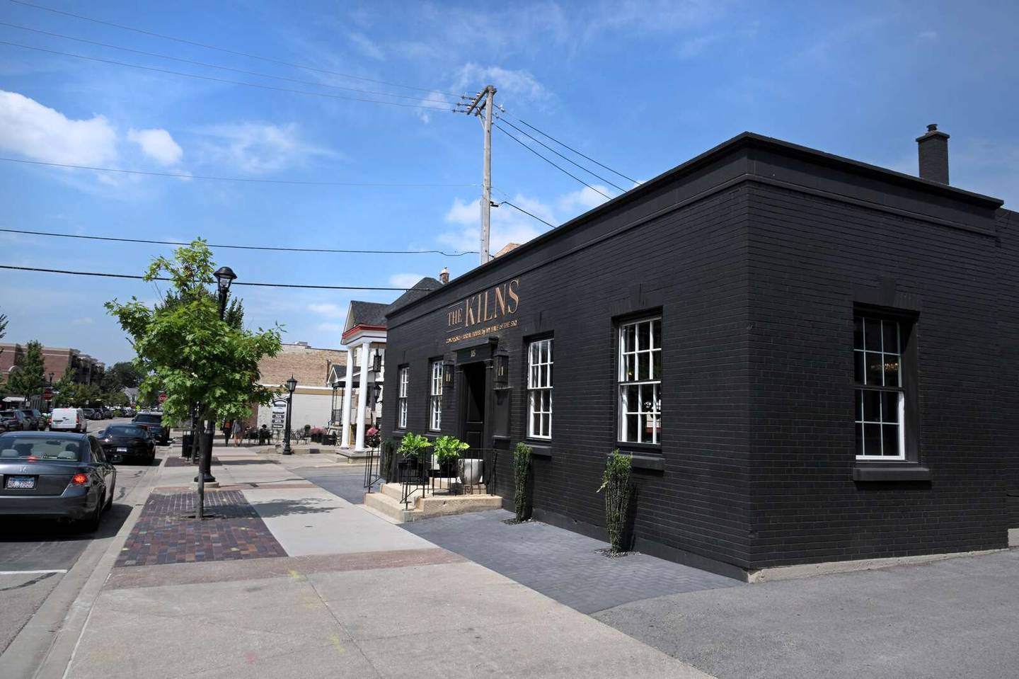 The Kilns, with both co-working and social spaces, is located in a brick building now painted black in downtown Wheaton.