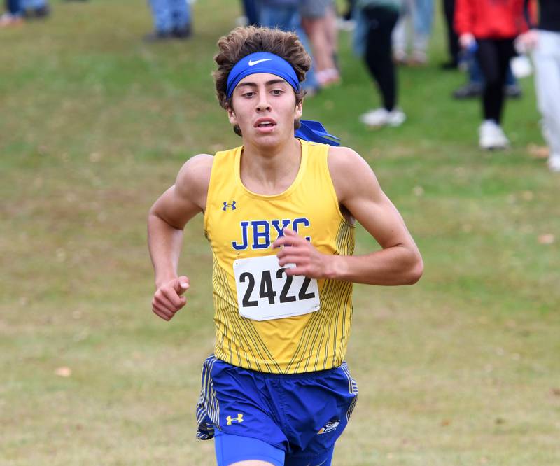 Johnsburg's Grady Smith sprints to the finish line at the Amboy Columbus Day Cross Country Invitational held at Shady Oaks Country Club near Amboy on Monday, Oct. 13, 2025. He finished first in 15:05.