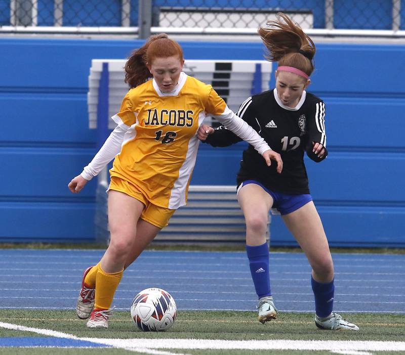 Jacobs' Delaney Lukowski tries to control the ball in front of Lake Zurich’s Morgan Kroger during a nonconference girls soccer match Tuesday, April 4, 2023, at Lake Zurich High School.