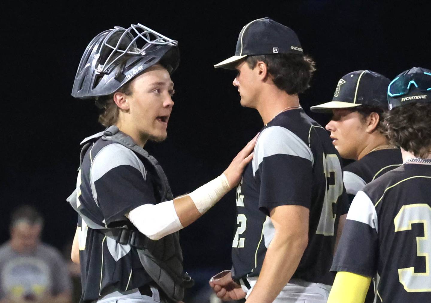 Sycamore catcher Kyle Hartmann visits the mound to talk to pitcher Kyle Prebil during their Class 3A sectional final game against Burlington Central Friday, May 31, 2024, at the Sycamore Community Sports Complex.