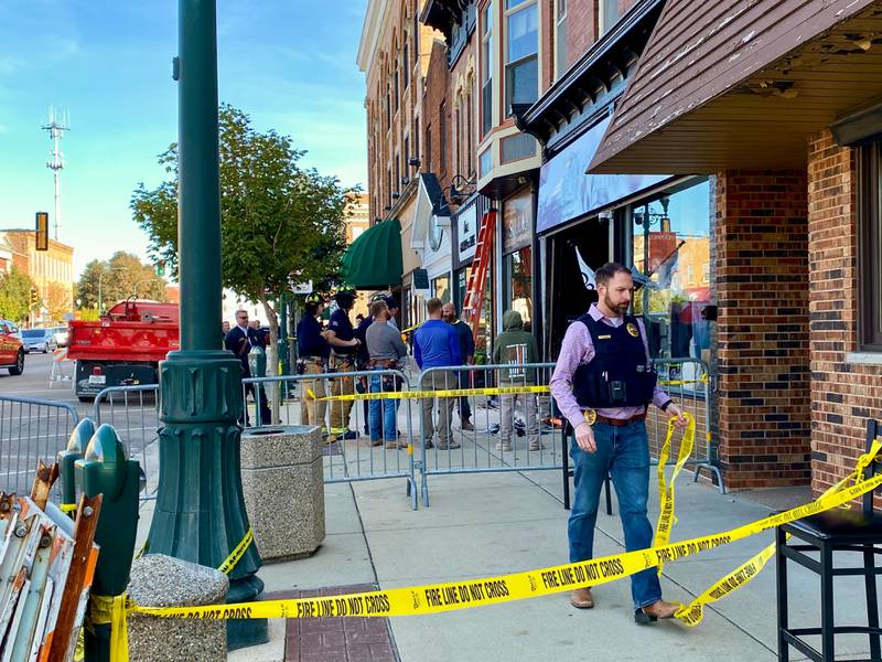 Sycamore police rope off a portion of the sidewalk in the 300 block of State Street downtown on Friday, Oct. 24, 2025, after a vehicle crashed into the front of Atlas Roots Collective women's clothing store, injuring two, authorities said.