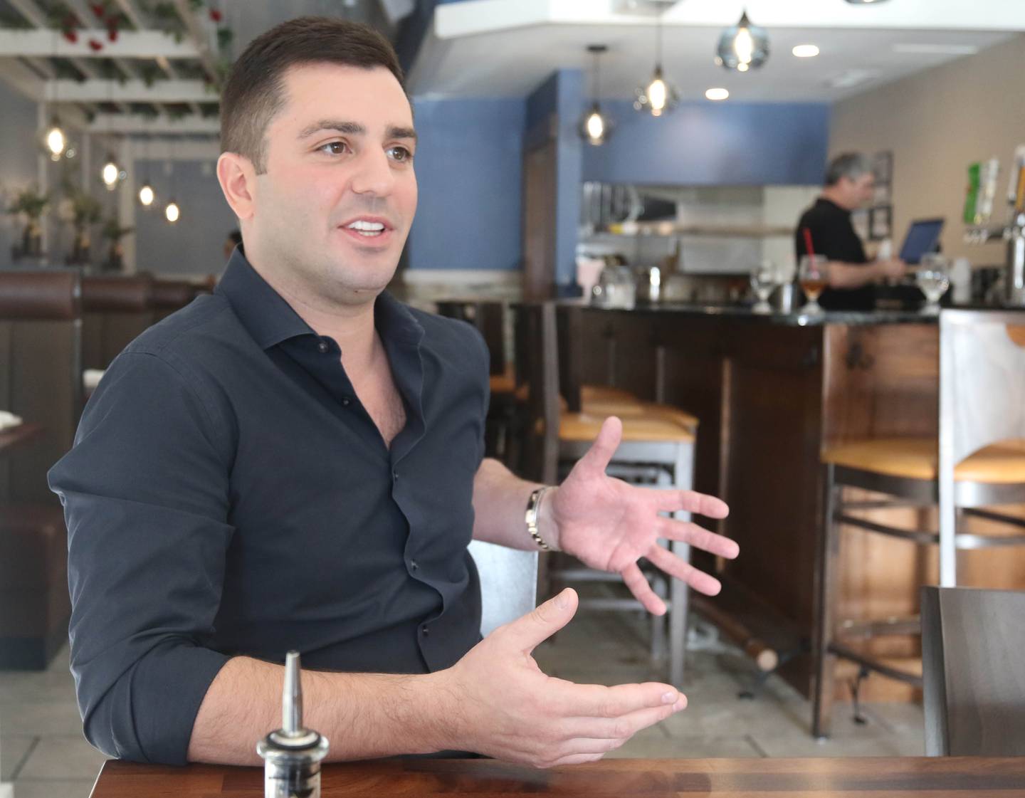 The Flame traditional Greek grill owner Foti Pappas talks about the new restaurant Friday, Jan. 19, 2024, in the location at 209 East Lincoln Highway in DeKalb.
