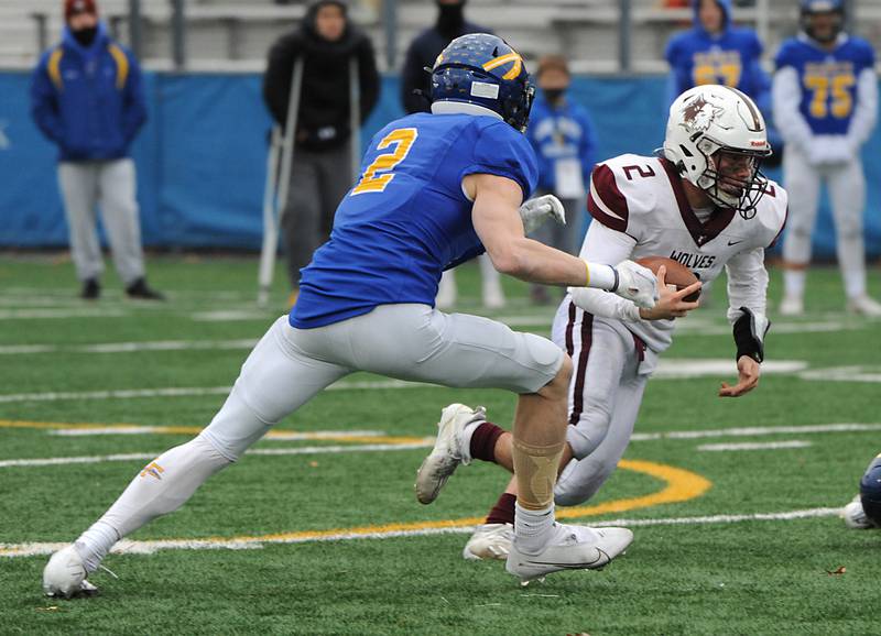 Prairie Ridge's Mason Loucks, right, cuts to avoid Lake Forest's Jake Milliman during the fourth quarter of their IHSA Class 6A quarterfinal football game on Saturday, Nov. 13, 2021, at Lake Forest High School.