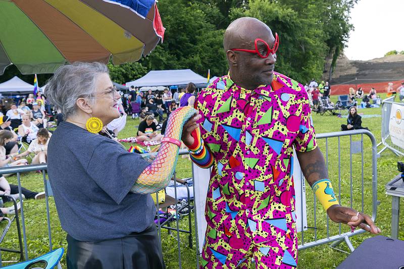 Nancy Webster of Dixon dances with Chris Shern, the front man for Invisible Cartoons, on Saturday, June 14, 2025, during Sauk Valley's Pride Fest in Dixon.