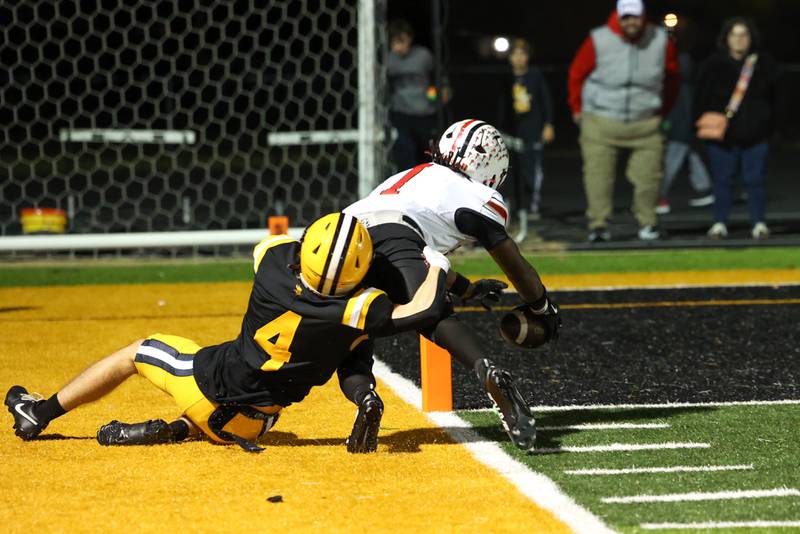 St. Laurence's Evan Malone prevents Bradley-Bourbonnais' Kyren Edmon from scoring a touchdown during the Vikings 35-21 victory over Bradley-Bourbonnais in second round playoff on Friday, Nov. 7, 2025.