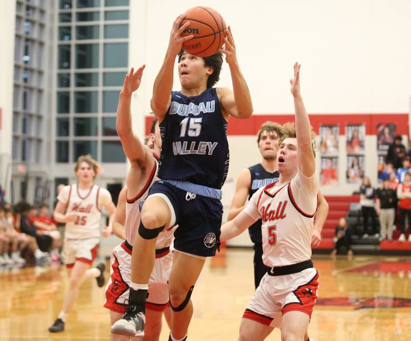 Bureau Valley's Corban Chhim eyes the hoop as he gets by Hall's Caleb Bickett on Tuesday, Feb. 6, 2024 at Hall High School.