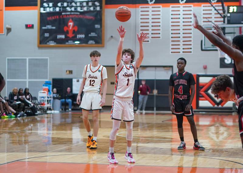 St. Charles East's Jake Greenspan (1) shoots a free throw late in the 4th quarter against East Aurora during the 64th annual Ron Johnson Thanksgiving Basketball Tournament at St. Charles East High School on Monday, Nov 20, 2023.