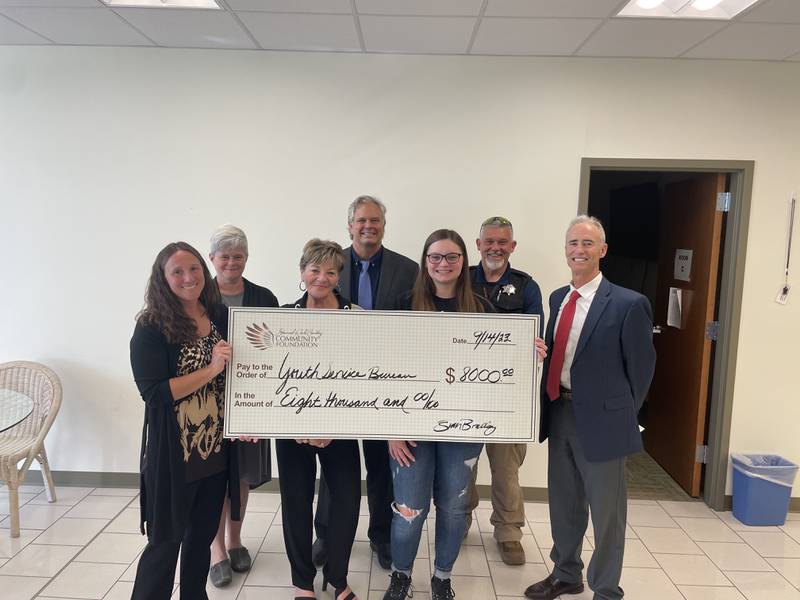 Commemorating Emily Hardee’s $8,000 gift to the Youth Service Bureau are YSB Treatment Director Jennifer Bauer (left), YSB Marketing Director Beth Osmund, SRCCF co-founder Pamela Beckett, YSB Executive Director Sam Tenuto, Emily Hardee, Eric Yacko (Emily’s father and volunteer) and SRCCF President Fran Brolley.