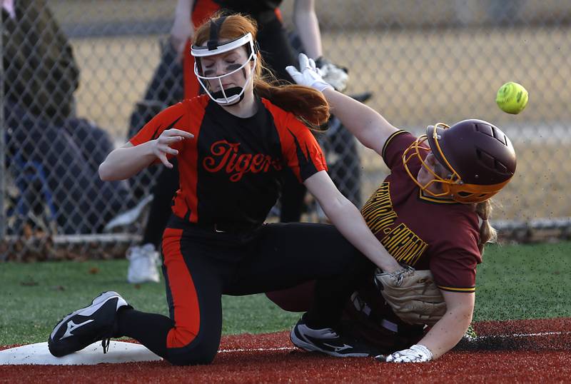 Crystal Lake Central's Makayla Malone looses the ball as Richmond-Burton's Lyndsay Regnier slides into third base during a nonconference softball game Wednesday March 16, 2022, between Crystal Lake Central and Richmond-Burton at Lippold Park in Crystal Lake.
