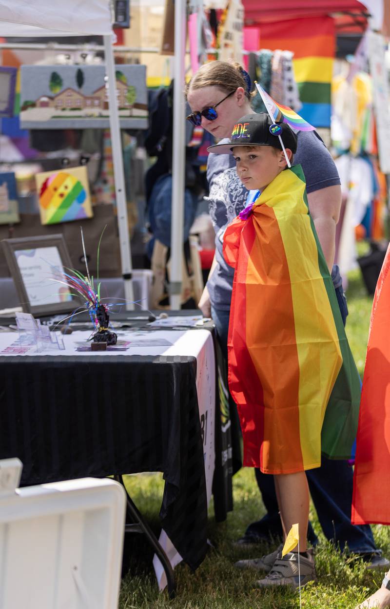 Pride festival goers browse among the vendor booths Saturday in Ottawa's Central Park.
