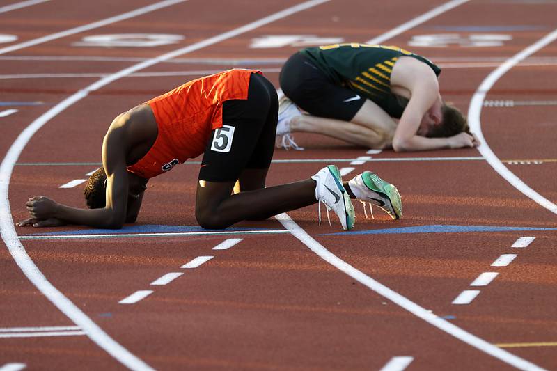 Crystal Lake Central’s Amana Omale and Crystal Lake South’s Adam Strombom gather their emotions after finishing the 800 meter run during the Huntley IHSA Class 3A Boys Sectional Track and Field Meet on Thursday, May 22, 2025, at Huntley High School.