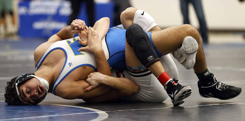 Wheaton North’s Julian Flores wrestles St. Charles East’s Anthony Gutierrez at 165-lbs at the 2025 DuKane Boys Varsity Tournament Saturday, Jan. 25, 2025 in St. Charles.