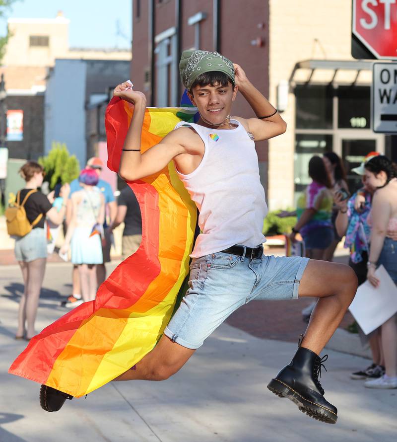 Sam De La Cruz, 15, from DeKalb, has some fun as he and his friends wait for the parade to start Thursday, June 23, 2022, during an event to celebrate Pride month in DeKalb. The function included a short parade through downtown and a showing of the movie “Tangerine,” with a panel discussion afterwards at the Egyptian Theatre.