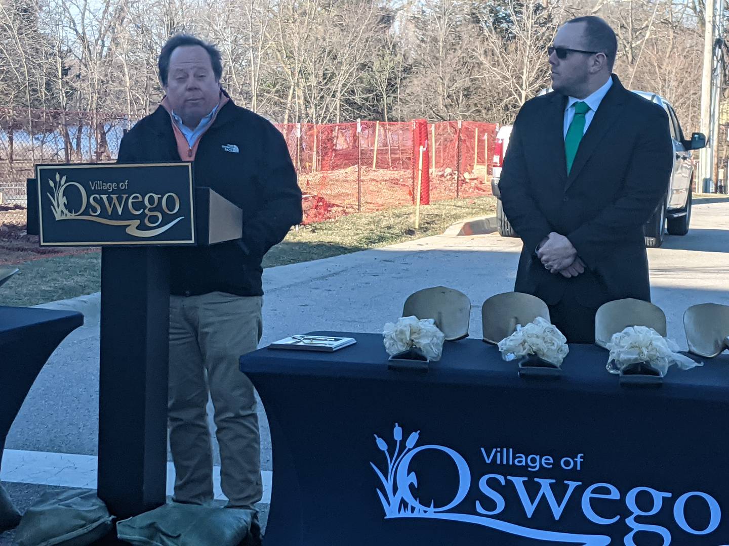 Shodeen Group President Dave Patzelt, left, speaks at a March 17 groundbreaking ceremony for the second building for The Reserve at Hudson Crossing luxury apartment complex. Looking on is Oswego Village President Ryan Kauffman, right.