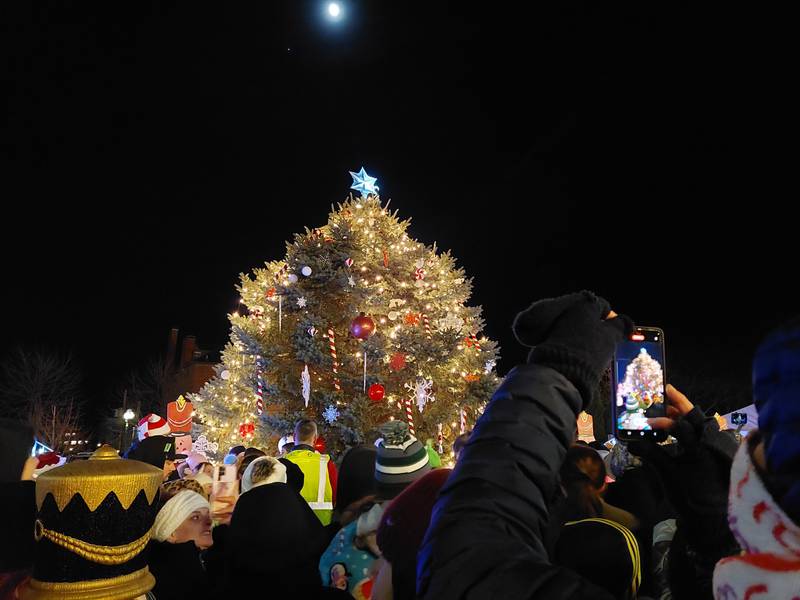 Capturing a picture perfect moment Friday, Nov. 24, 2023, as the Christmas tree is lit in the Jordan block during the Festival of Lights in Ottawa.