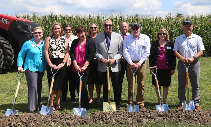 Members of the Illinois Valley Community College Board of Directors pose for a photo during a groundbreaking ceremony of the new Dr. Alfred E. Wisgoski  Agricultural Education on Friday, Aug. 22, 2025 at Illinois Valley Community College in Oglesby. The new building, received a one-million dollar donation from the Wisgoski family, funds from the federal Economic Development Administration and the state of Illinois Department of Commerce and Economic Opportunity, will not only provide physical spaces that reflect the program’s growth, innovation, and capabilities, but the IVCC Agricultural Education Center will also serve as a focal point for agricultural industry activities within the community. The building will take one-year to complete.