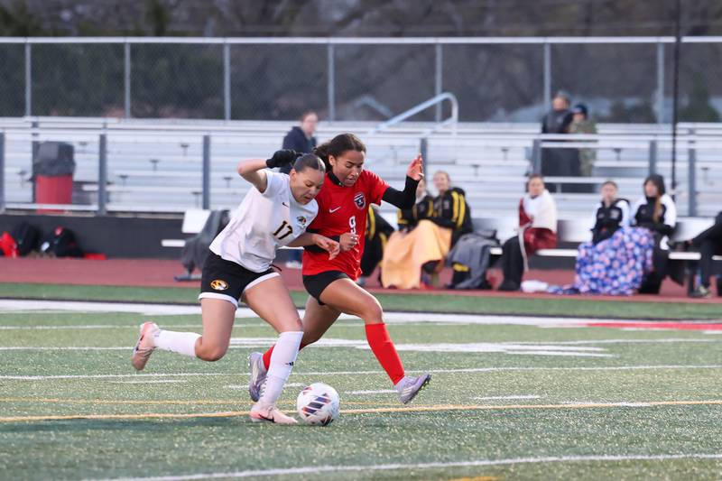 Herscher's Leia Haubner defends a run by Bradley-Bourbonnais' Nia Lawrence, right, during the Boilermakers' 4-3 victory on Monday, April 6, 2026.